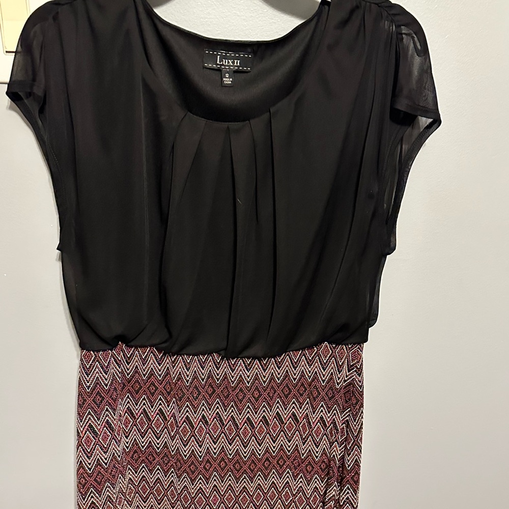 Black top with red, black, and silver on the bottom.